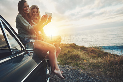 Buy stock photo Friends at sunset, women and selfie on beach, travel and adventure on car outdoor, nature and sea holiday. Road trip mockup, happy in picture on summer vacation, smartphone photography and lens flare