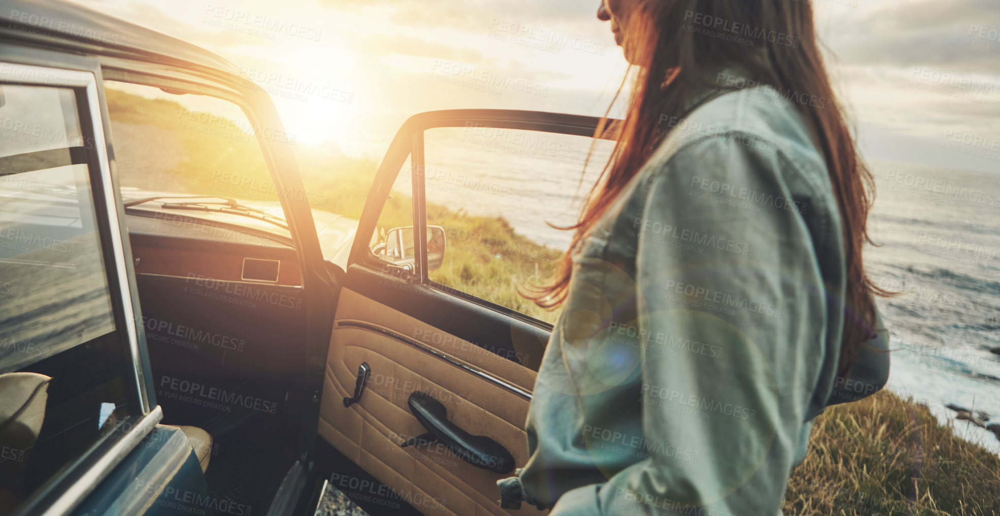 Buy stock photo Vintage car, sunset and woman by ocean for road trip, travel and summer vacation for journey, adventure and freedom. Young, gen z driver by sea, ocean or lake for retro lifestyle with transportation