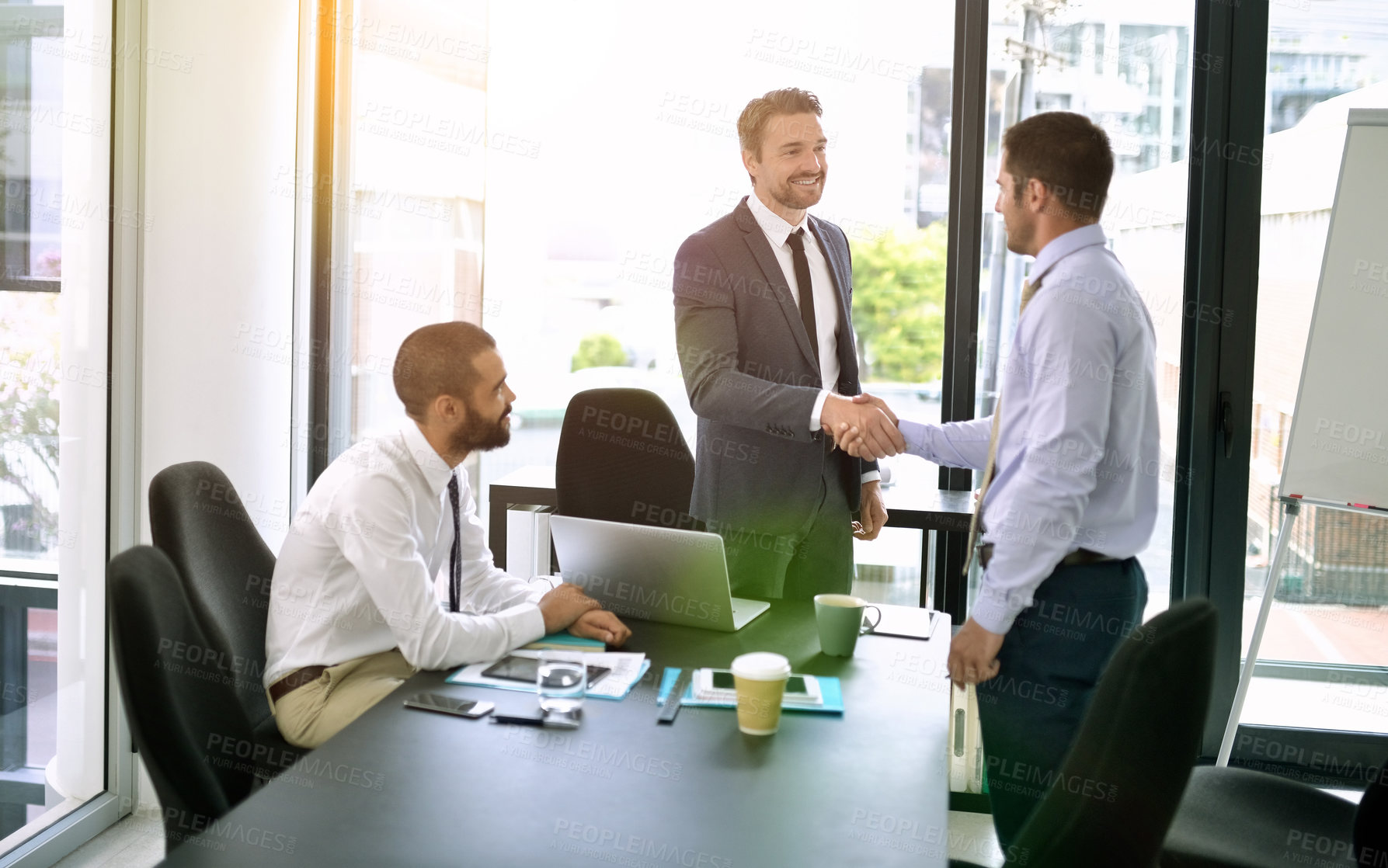 Buy stock photo Handshake, meeting and success with business men in boardroom of office for bonus or promotion. Congratulations, deal and thank you with employee people shaking hands in workplace for agreement