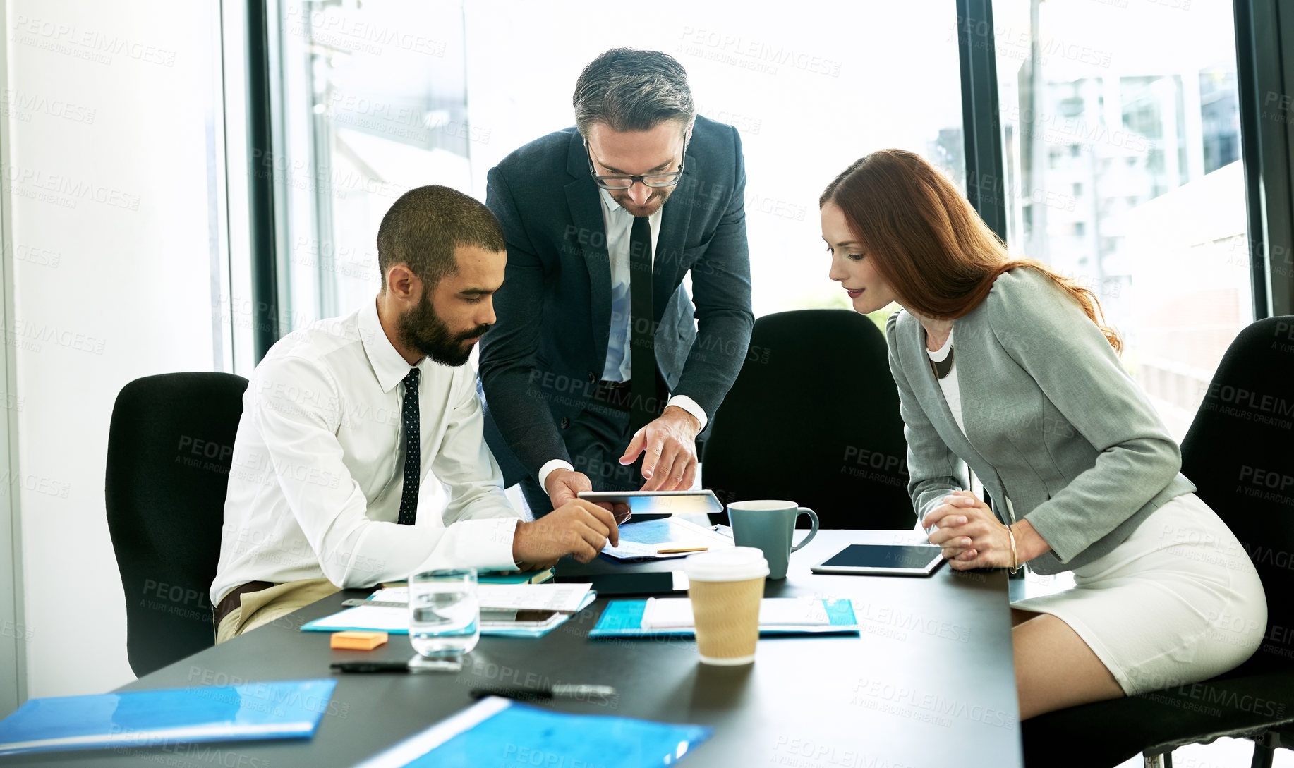 Buy stock photo Shot of a team of executives having a formal meeting in a boardroom