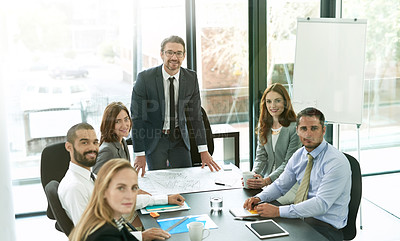 Buy stock photo Portrait of a team of executives having a formal meeting in a boardroom