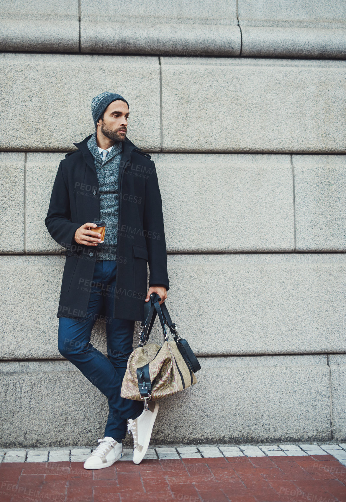 Buy stock photo Thinking, bag and businessman at wall space for fashion winter style or travel on morning commute in city. Sidewalk, confident or tourist downtown for international work, opportunity or career growth