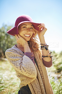 Buy stock photo Portrait of an attractive young woman in a sunhat standing outside