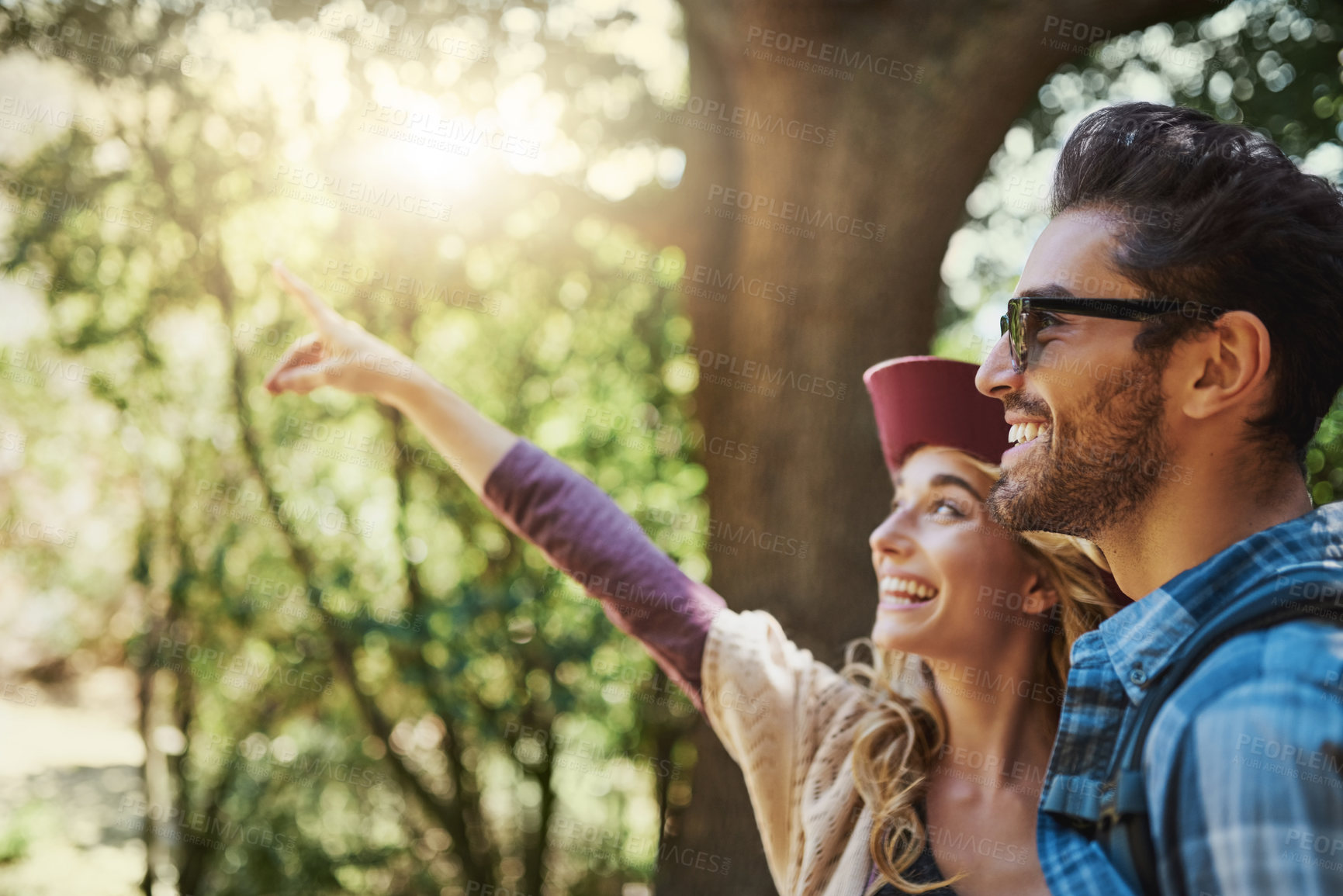 Buy stock photo Happy, couple and pointing in forest with travel for outdoor adventure, sightseeing and direction. Man, woman and smile with showing gesture in nature for vacation, scenery and tourism in Brazil