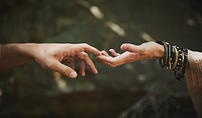 Buy stock photo Cropped shot of a couple touching each other’s fingers