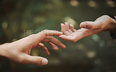 Buy stock photo Cropped shot of a couple touching each other’s fingers