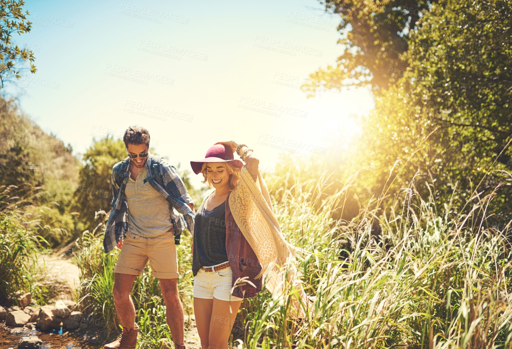 Buy stock photo Couple, holding hands and travel in outdoor nature, freedom support and explore woods together. People, walking and forest for holiday hiking adventure, partnership trust and countryside trekking