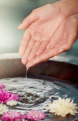 Buy stock photo Water, flowers and hands at spa for skincare, wellness or relax at sustainable luxury salon. Finger, nail or organic bowl closeup for clean, beauty or person in healthy natural treatment for manicure