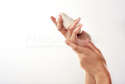 Buy stock photo Closeup studio shot of a woman's hands holding a bar of soap