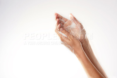 Buy stock photo Closeup studio shot of a woman washing her hands