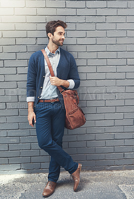 Buy stock photo Happy, businessman and leather bag for fashion, style and comfort outdoors with a wall background. Formal model, smile and clothes for working, career or job opportunity with outside brick backdrop