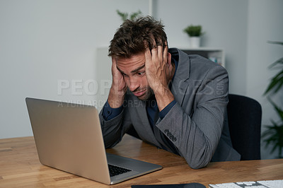 Buy stock photo Portrait of an overwhelmed businessman sitting at his desk with his face in his hands