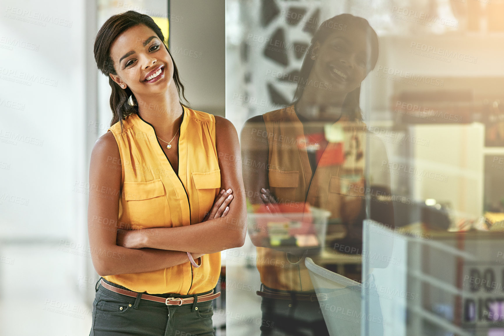 Buy stock photo Portrait of a smiling young woman working in an office