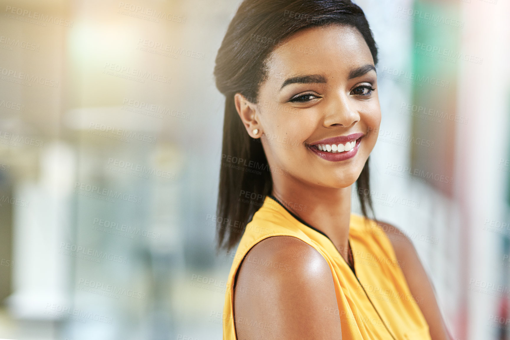 Buy stock photo Portrait of a smiling young woman working in an office