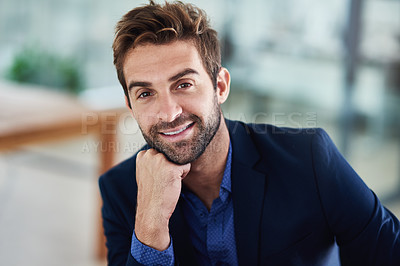 Buy stock photo Portrait of a young businessman sitting in an office