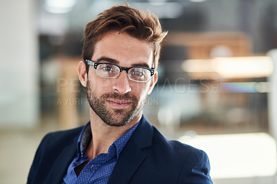 Buy stock photo Portrait of a young businessman sitting in an office