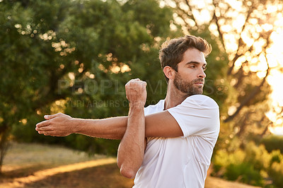 Buy stock photo Athlete, man and stretching in nature before running, fitness and exercise in summer for workout. Healthy male person, cardio and motivation for wellness in sunshine for strong, training and sport