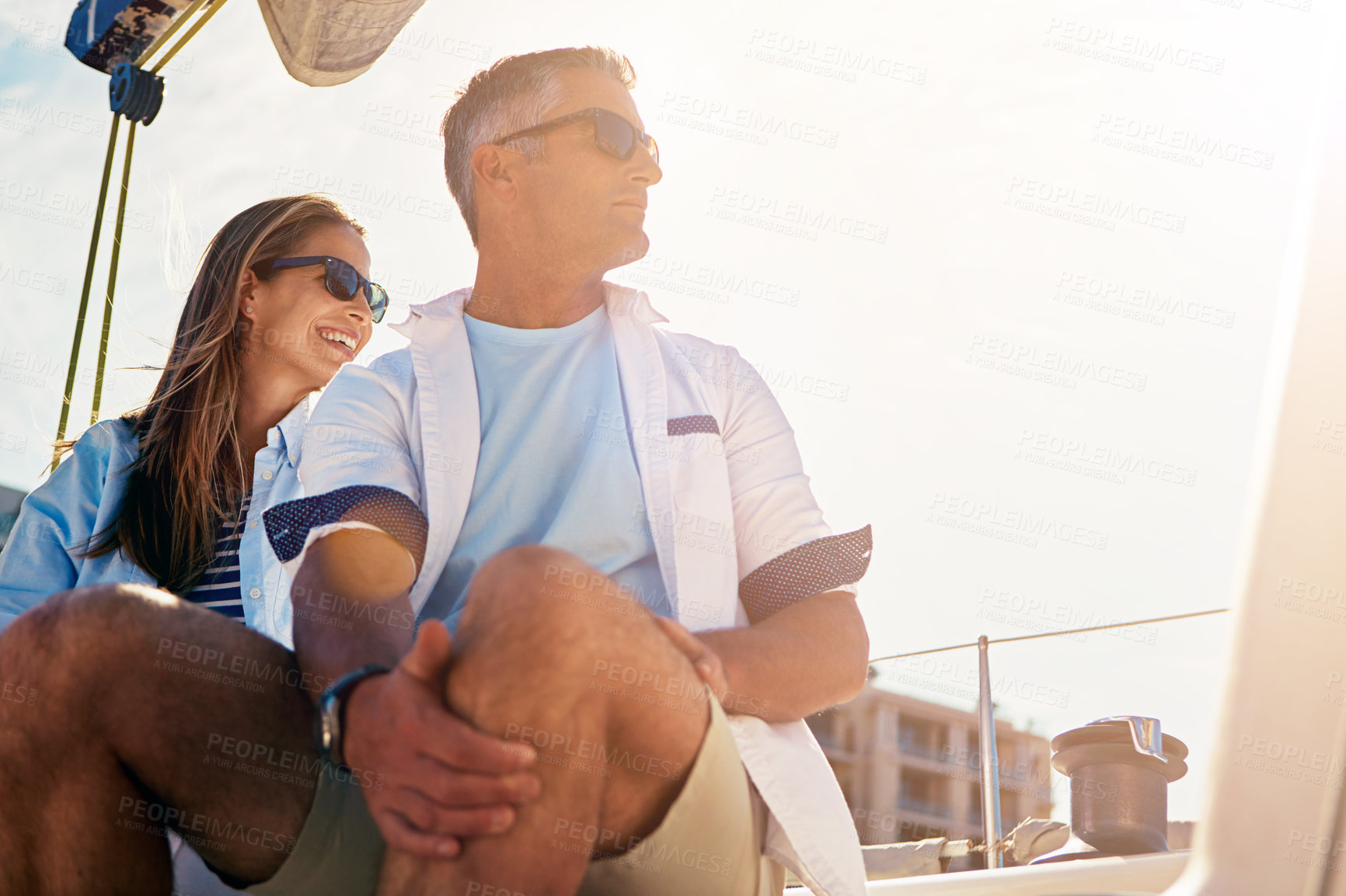 Buy stock photo Shot of a couple out sailing on a yacht