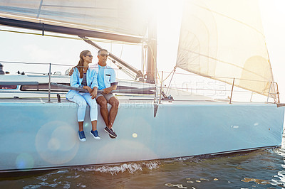 Buy stock photo Yacht, relax and travel with a mature couple sitting on a boat out at sea for love, romance or dating together. Water, summer and ship with a man and woman enjoying a trip on the ocean while bonding