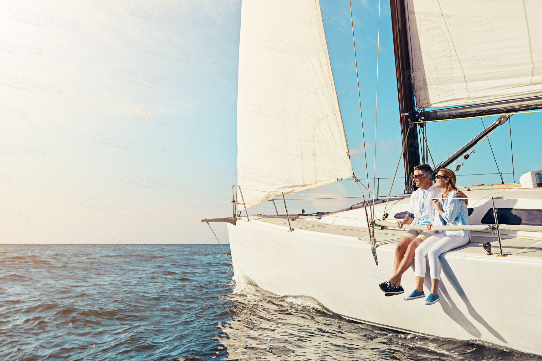 Buy stock photo Relax, travel and luxury with couple on yacht for summer, love and sunset on Rome vacation trip. Adventure, journey and vip with man and woman sailing on boat for ocean, tropical and mockup at sea