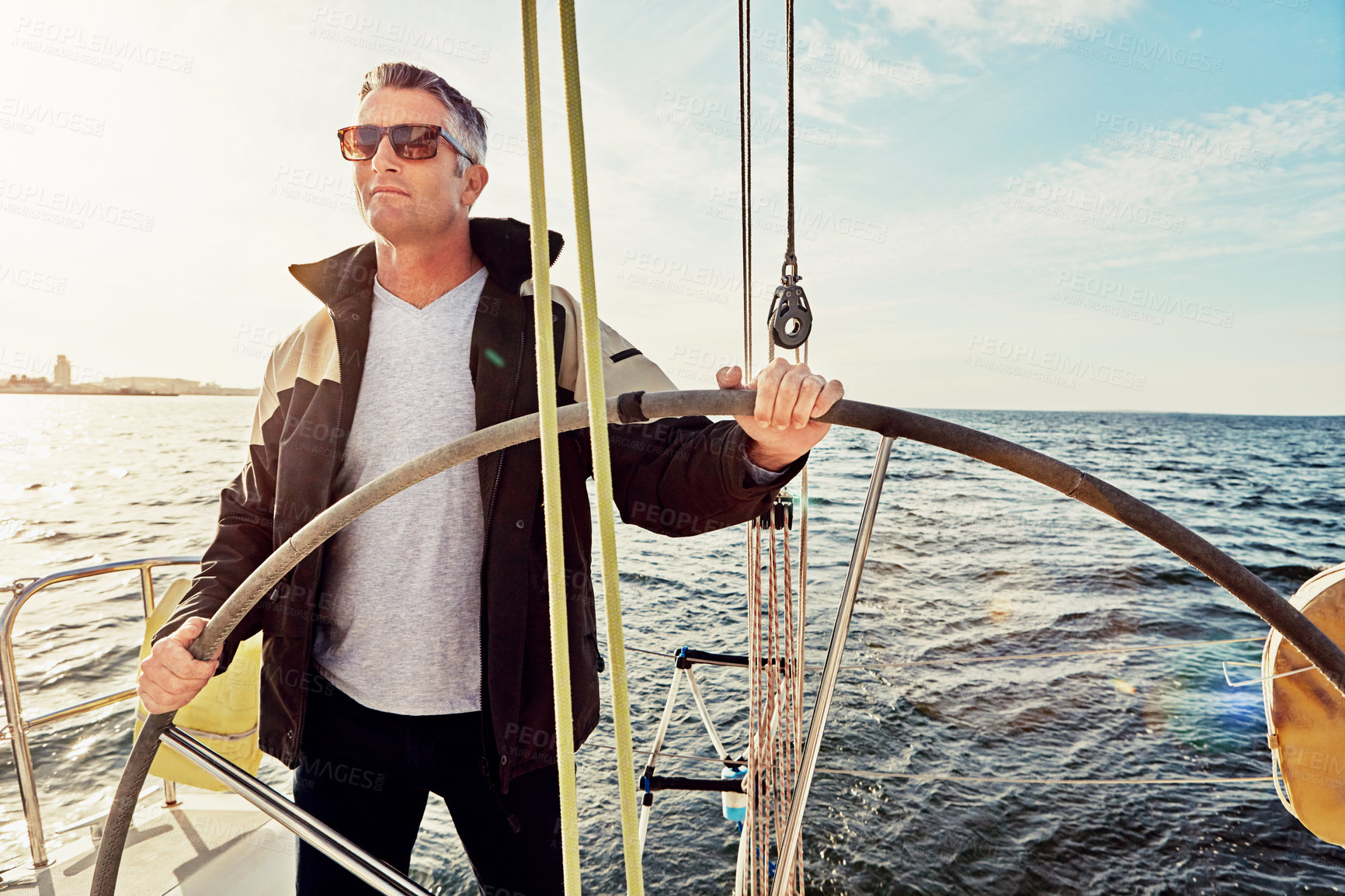 Buy stock photo Shot of a man out on a boat trip alone