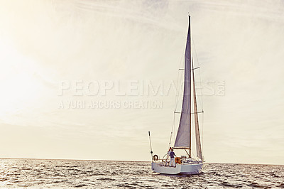 Buy stock photo Shot of a couple out sailing on a yacht