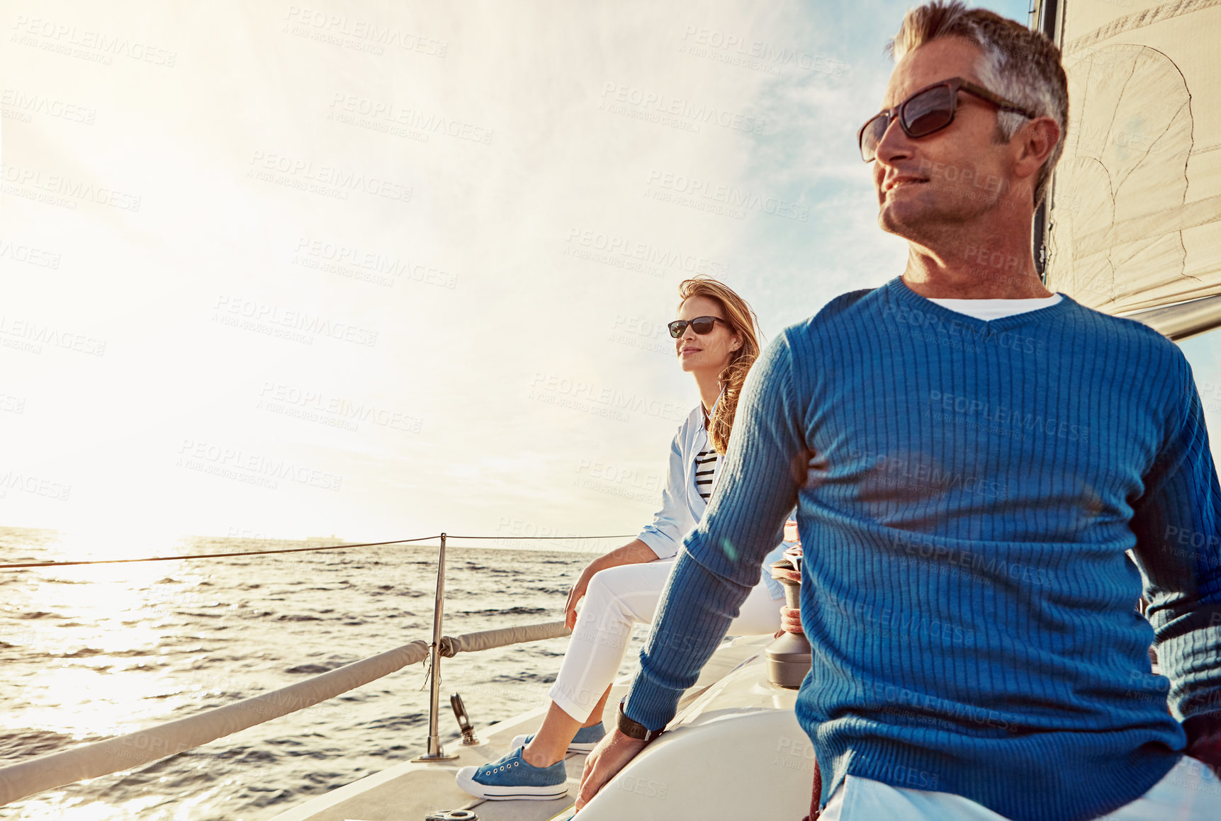 Buy stock photo Shot of a couple out sailing on a yacht