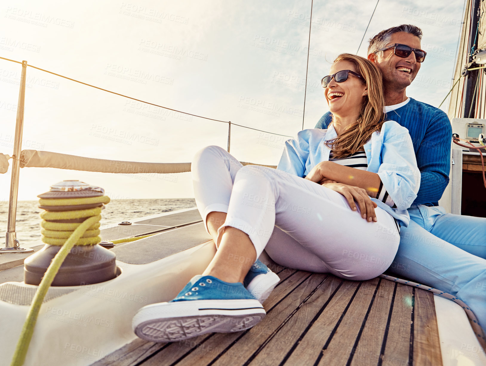 Buy stock photo Smile, happy and couple on a yacht at sea, summer travel and ocean adventure in Spain. Peace, hug and man and woman on a boat for a luxury cruise, sailing and happiness on holiday on the water