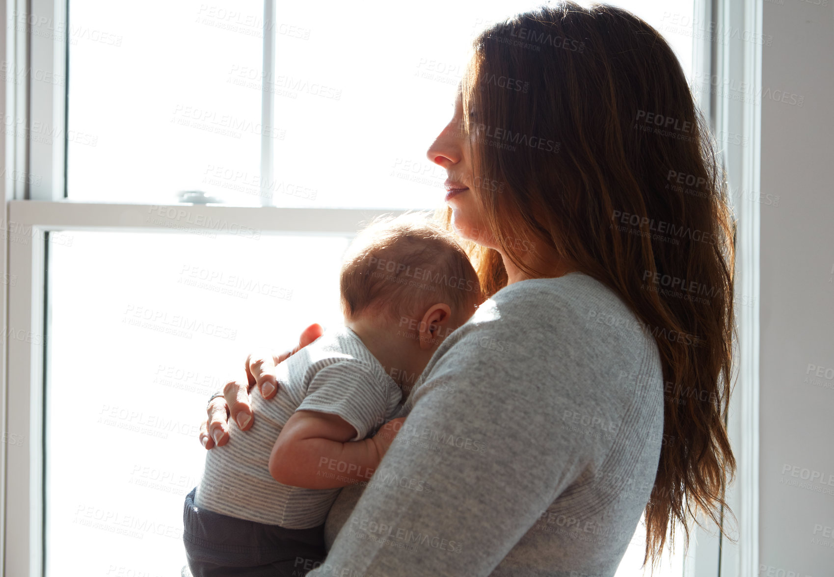 Buy stock photo Shot of a mother holding her newborn baby