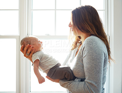 Buy stock photo Shot of a mother holding her newborn baby