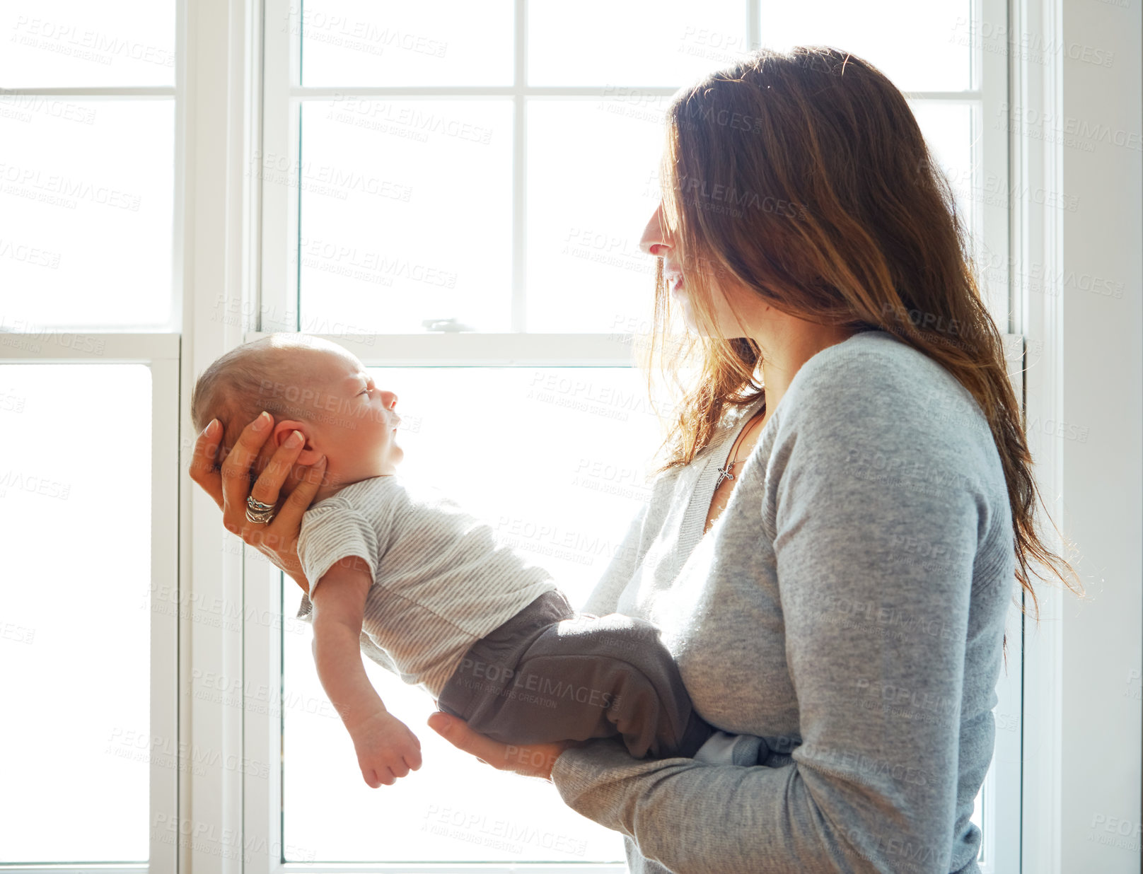 Buy stock photo Shot of a mother holding her newborn baby