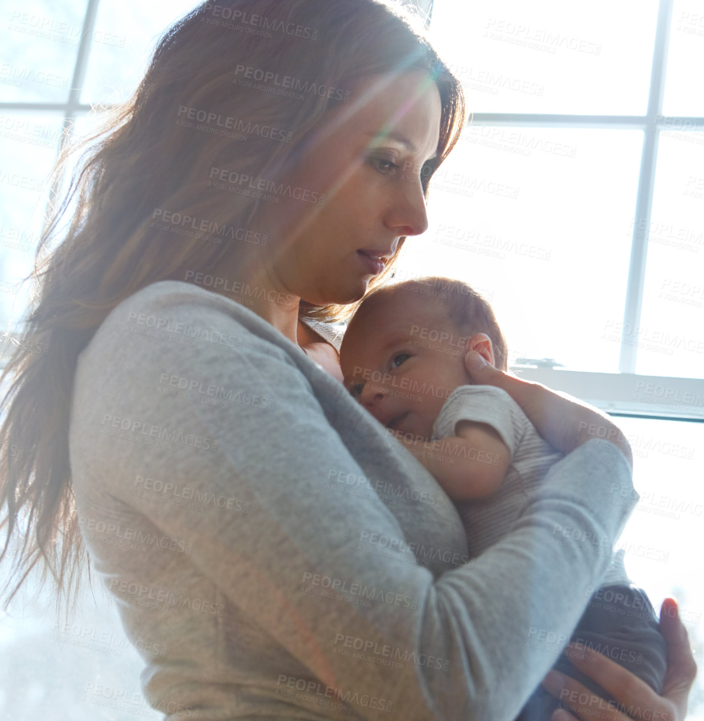 Buy stock photo Shot of a mother holding her newborn baby