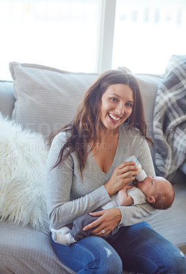 Buy stock photo Portrait of a mother feeding her newborn baby