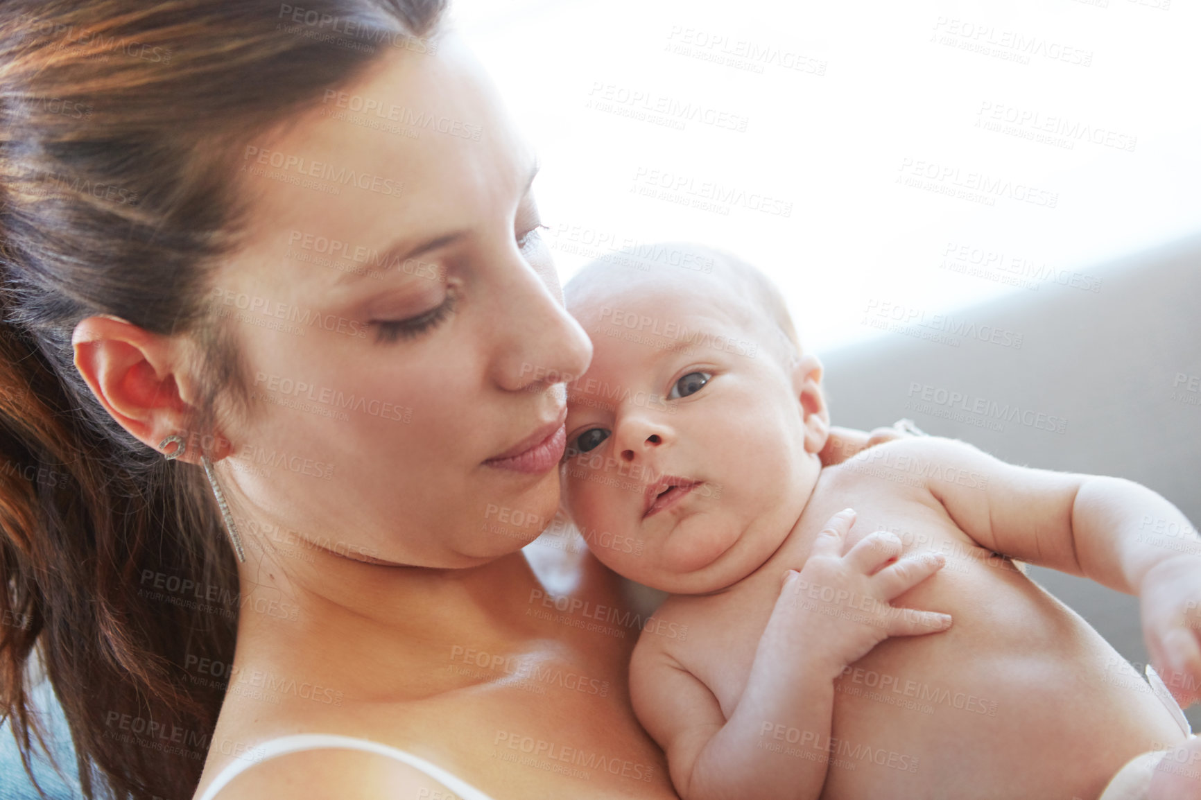 Buy stock photo Closeup shot of a mother holding her newborn baby