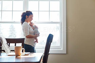 Buy stock photo Shot of a mother holding her newborn baby