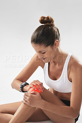Buy stock photo Fitness, injury and knee pain, woman and red glow for muscle or tendon tension isolated on white background. Exercise, athlete and anatomy overlay with inflammation, swollen or strain from training