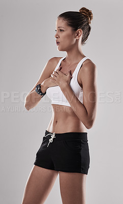 Buy stock photo Woman, athlete and chest pain in studio, breathing and asthma stress or stroke on gray background. Female person, runner and heart attack risk from marathon or training, heartburn and ache or sore
