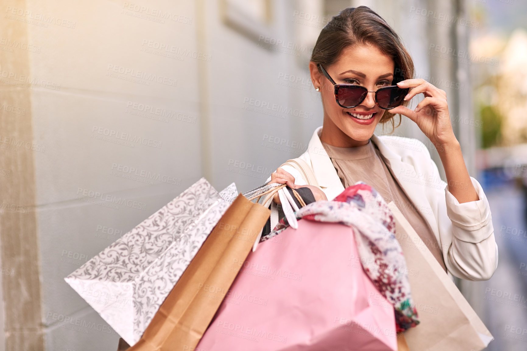 Buy stock photo Portrait, shopping bag or happy rich woman in city walking on urban street for boutique retail sale or clothes. Sunglasses, smile or fashionable girl customer on road searching for luxury products 