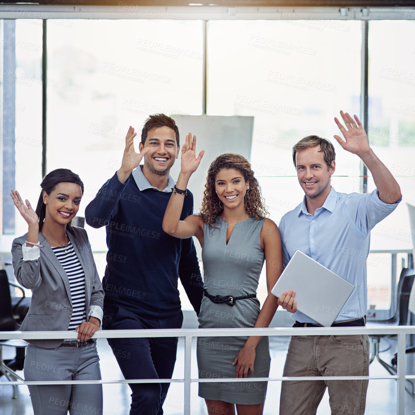 Buy stock photo Portrait of a group of colleagues waving together in an office