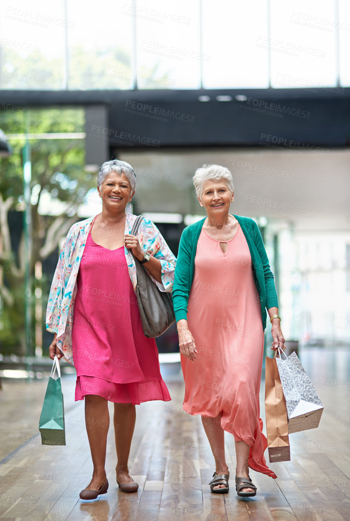 Buy stock photo Full length portrait of a two senior women out on a shopping spree