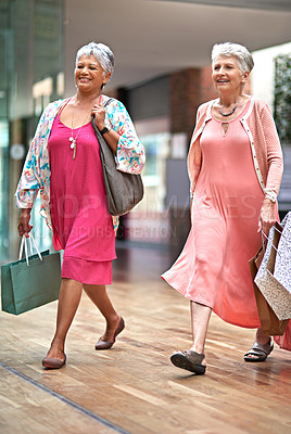 Buy stock photo Full length shot of a two senior women out on a shopping spree