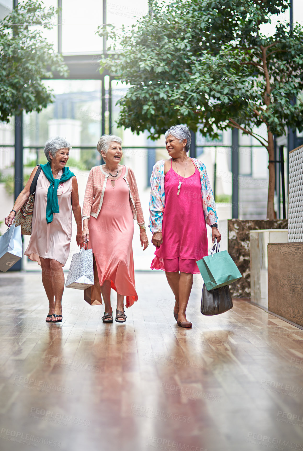 Buy stock photo Full length shot of a three senior women out on a shopping spree