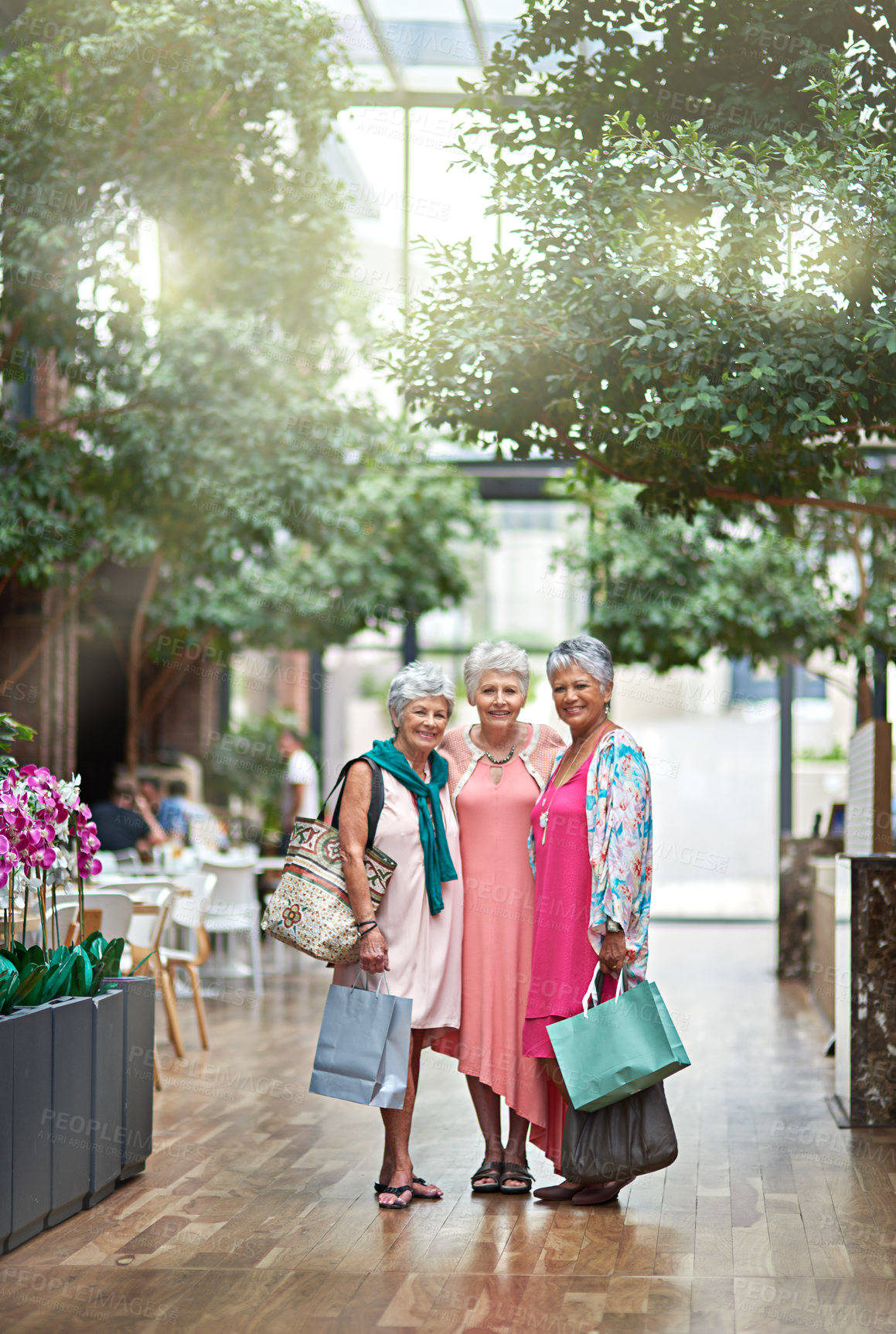 Buy stock photo Full length portrait of a three senior women out on a shopping spree