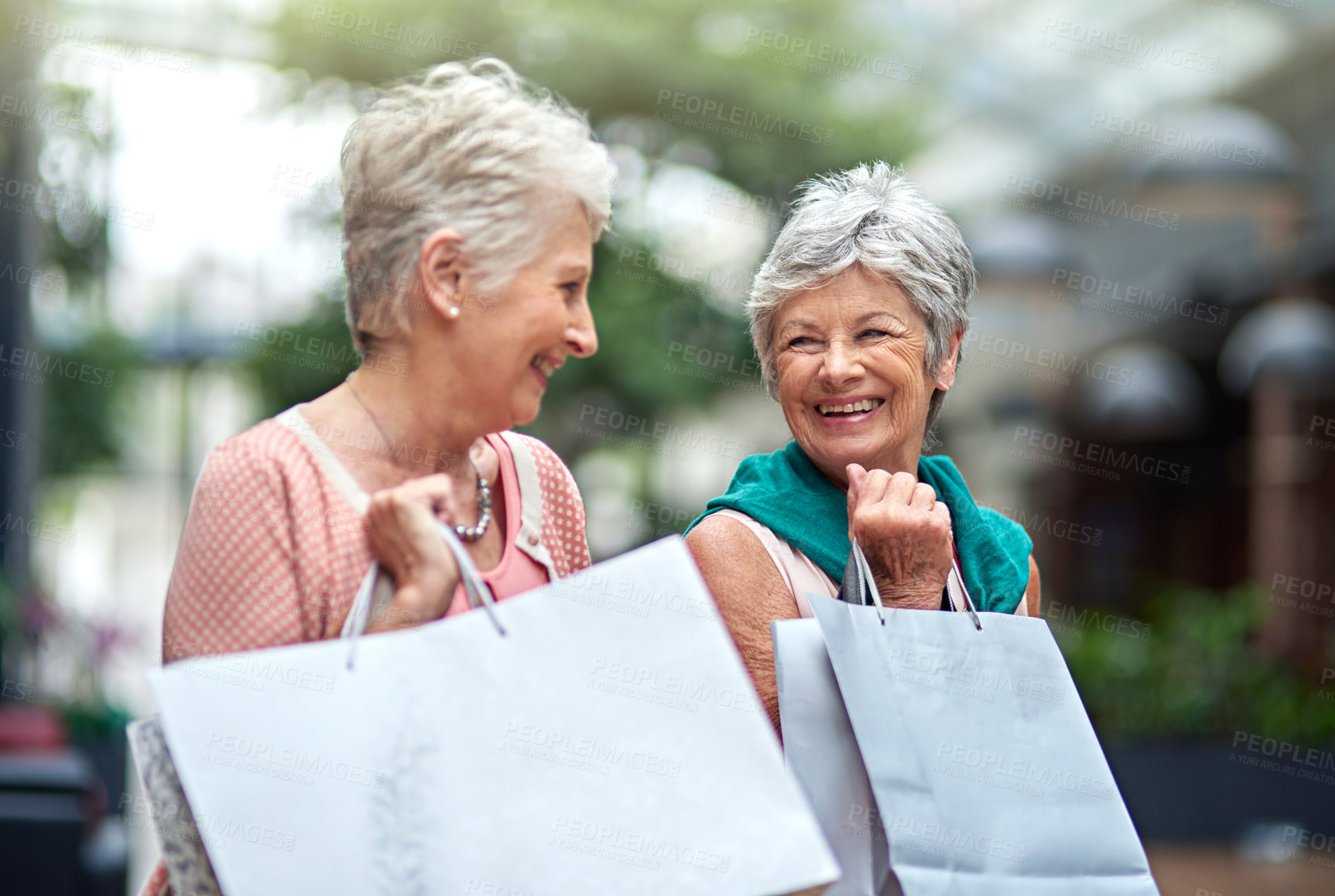 Buy stock photo Cropped shot of a two senior women out on a shopping spree