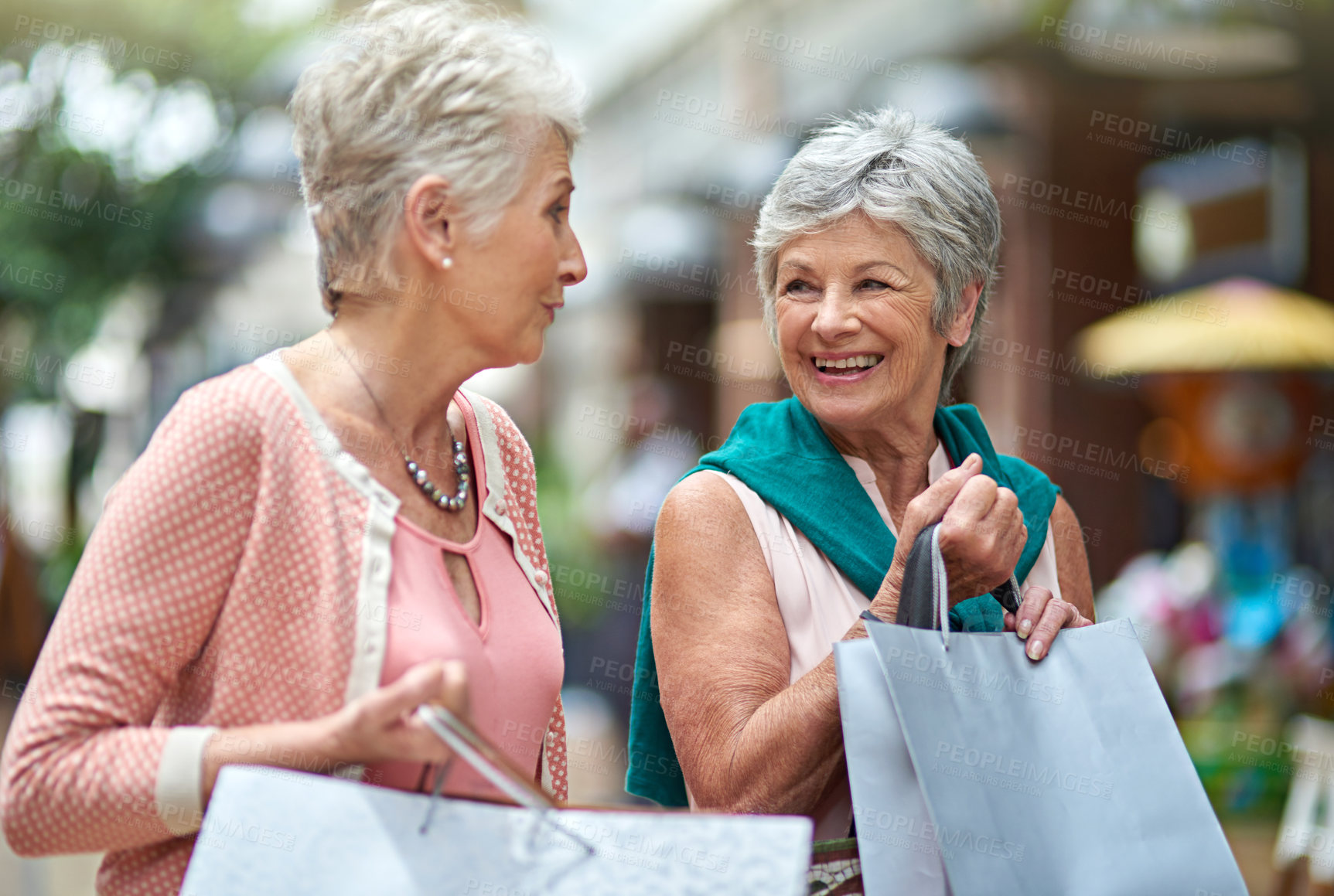 Buy stock photo Cropped shot of a two senior women out on a shopping spree