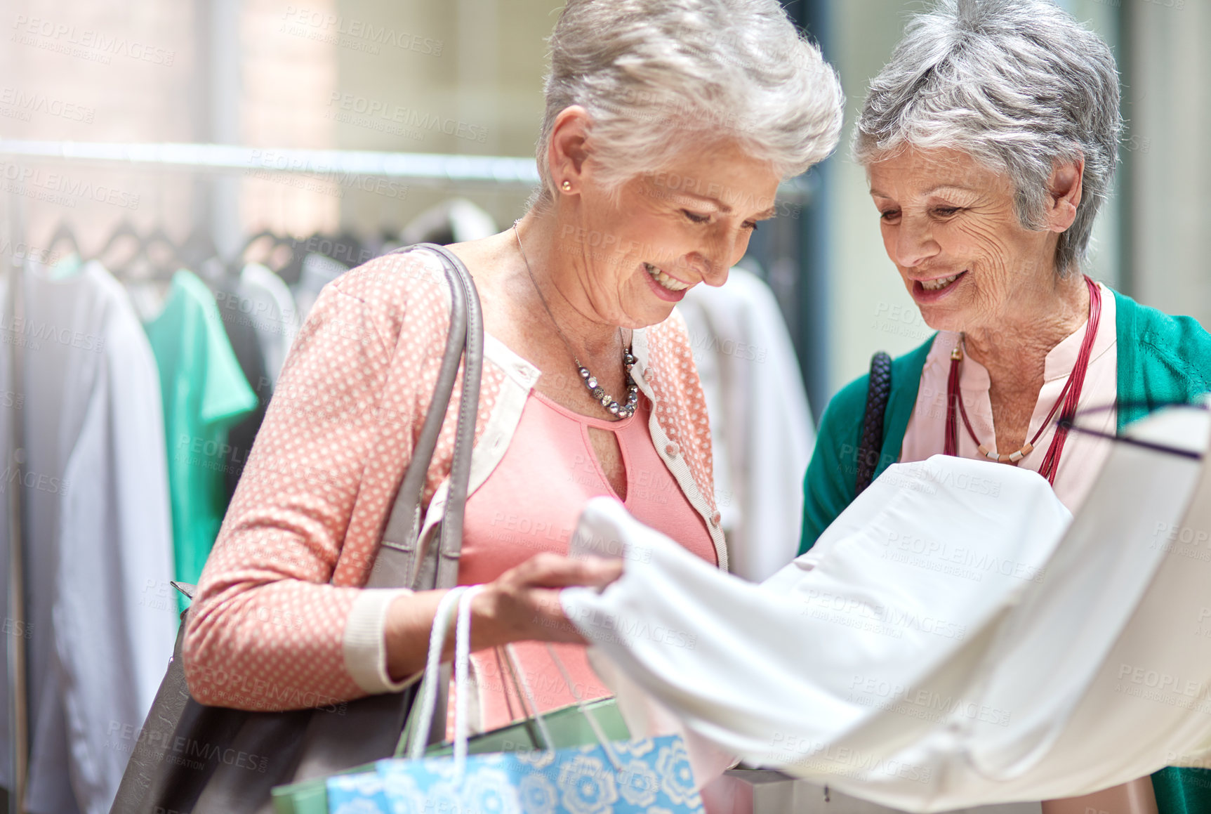 Buy stock photo Cropped shot of a two senior women out on a shopping spree