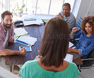 Buy stock photo Shot of a young businesswoman giving a presentation to her design team