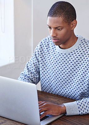 Buy stock photo Cropped shot of a young designer working on his laptop