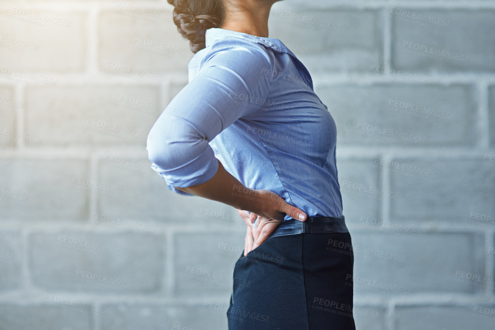 Buy stock photo Cropped shot of a businesswoman suffering from back pain