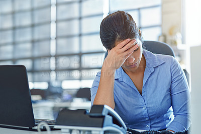 Buy stock photo Shot of a businesswoman experiencing stress at work